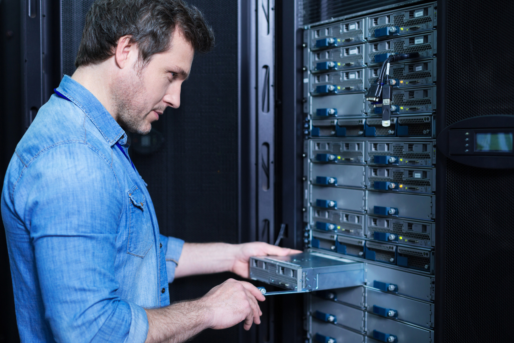 IT Technician Installing Server